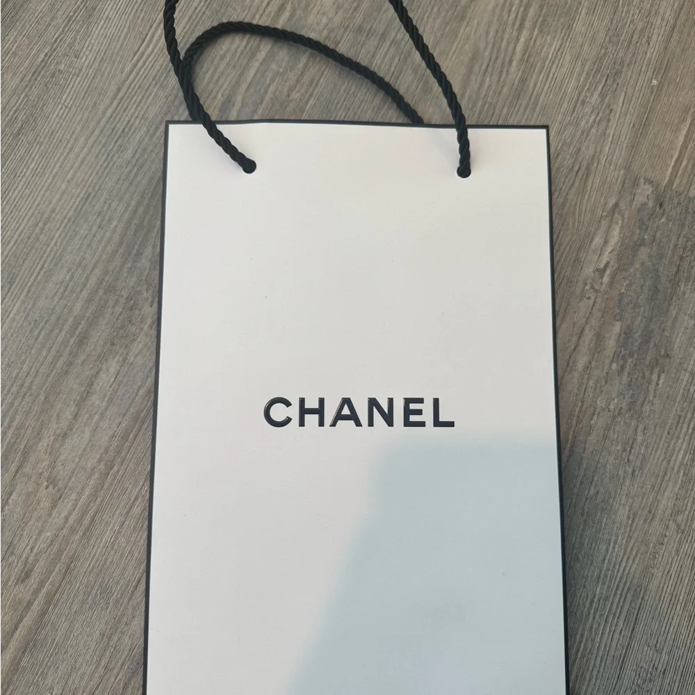 Chanel, Louis Vuitton, and Santa Maria Novella empty shopping bags - Picture 2 of 4